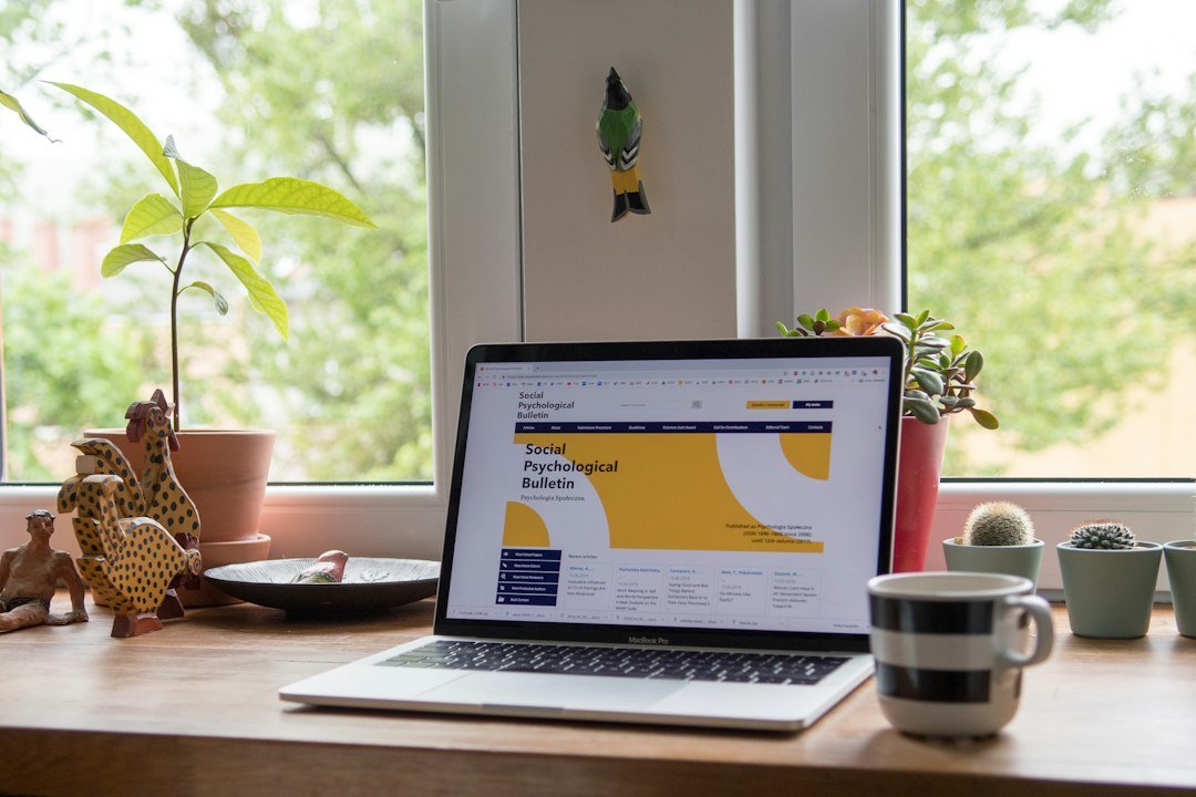 Laptop displaying a website on a desk, representing reviewing what a business website actually shows